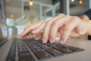 closeup business woman hand typing laptop keyboard